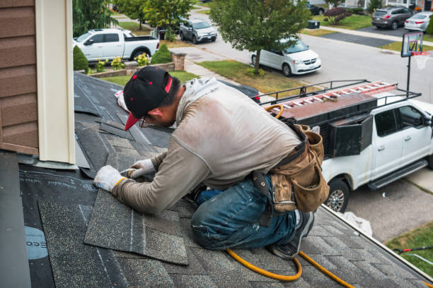 Professional Roofing technician working in Bedford, NY